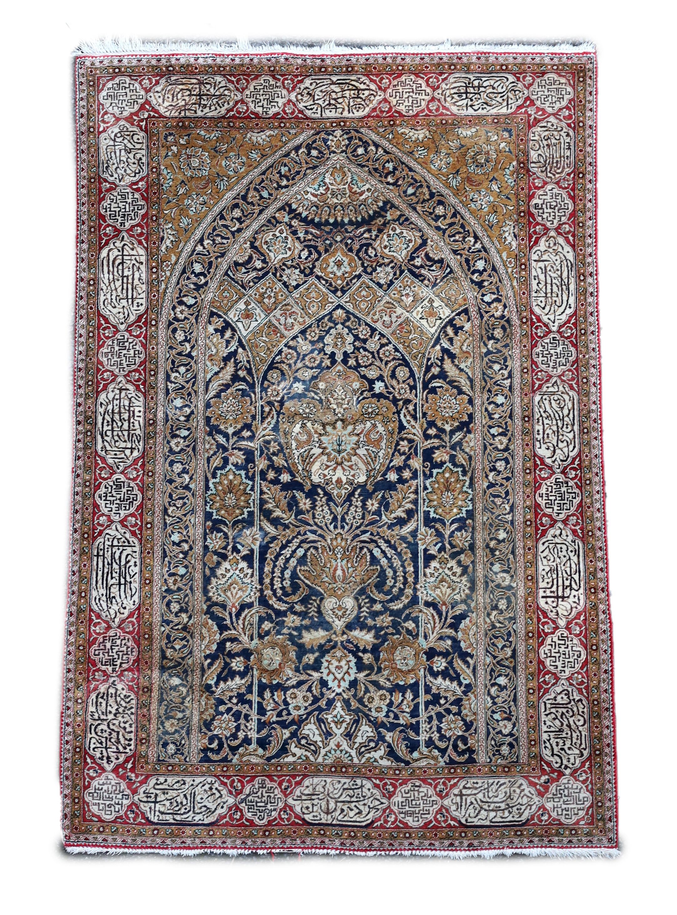 An early 20th century Kashan silk blue ground prayer rug, 162 x 109cm.